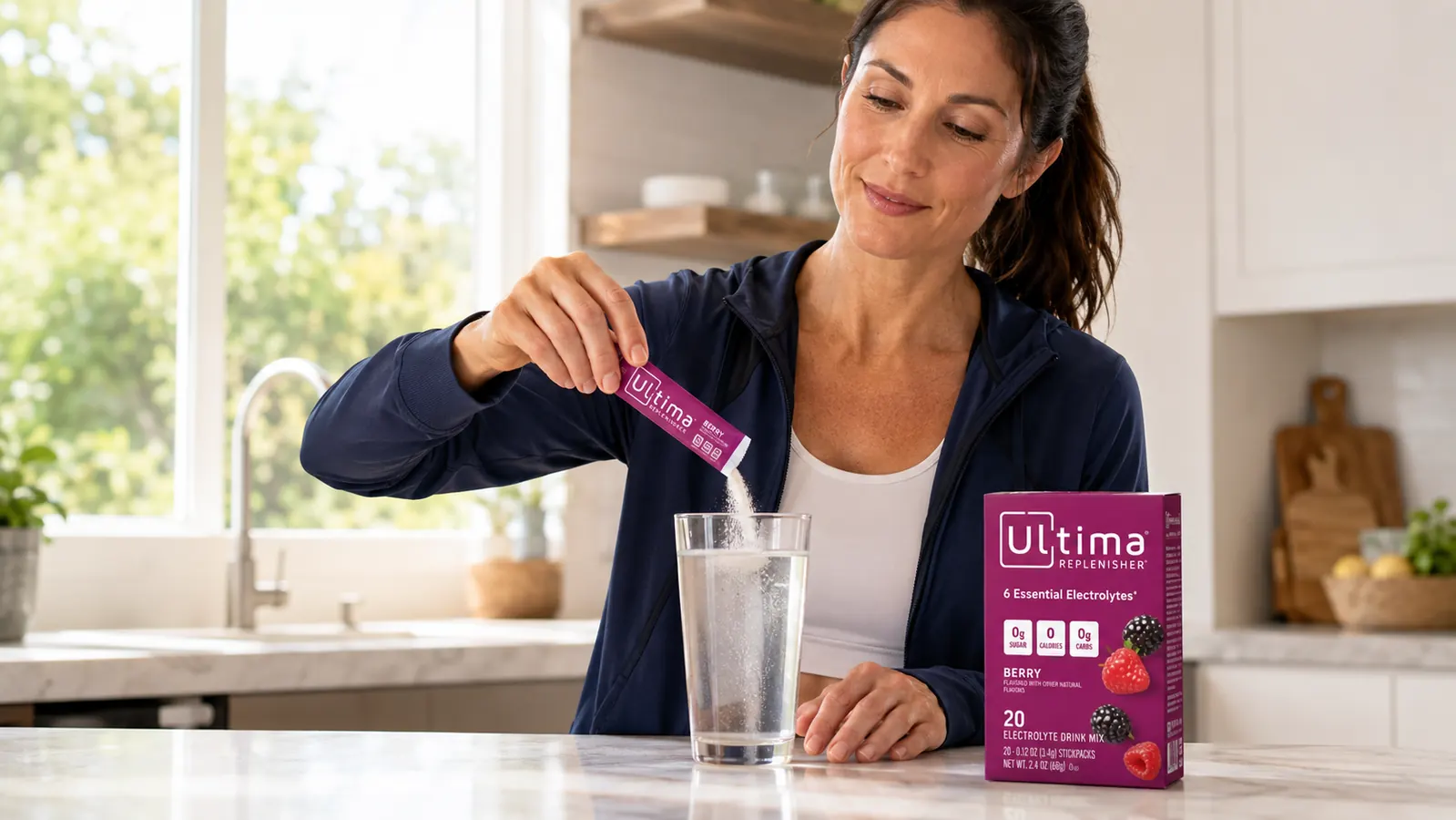 Ultima Replenisher variety pack stick-packs fanned out next to a water bottle on a gym bag